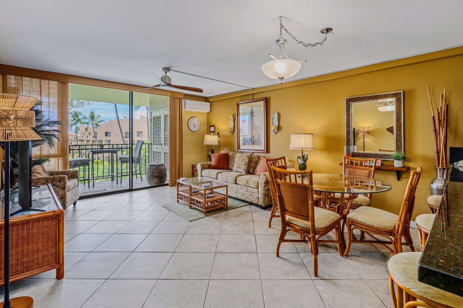 Kihei Vacation Rentals, Kamaole Sands 5310 - Slide the door open and the lanai seating is right there, just past the couch.