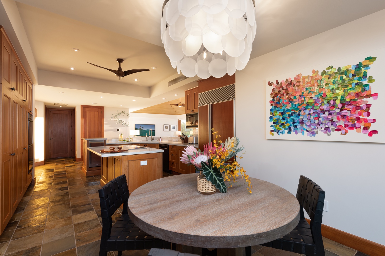 Kailua Kona Vacation Rentals, 3BD Waiulu Villa 111D at Hualalai Resort - Dining area with a round table seating four, complemented by chic decor and natural light.