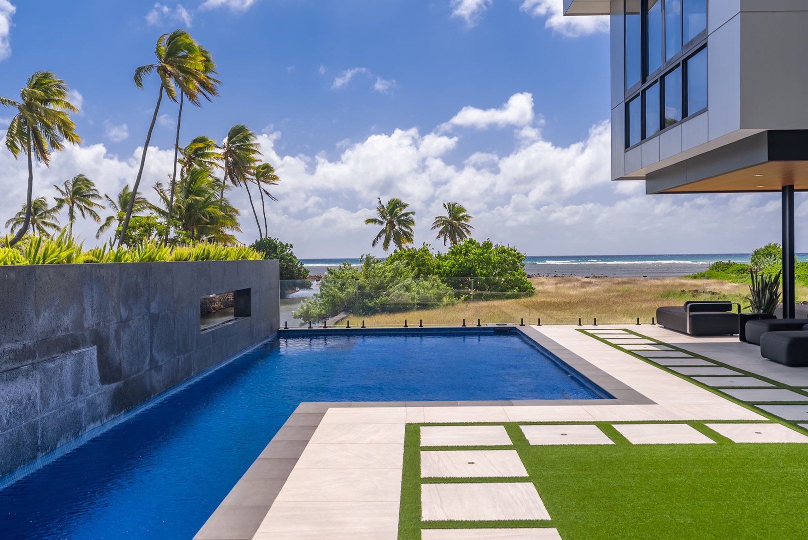 Honolulu Vacation Rentals, Ocean Villa 3 Bedroom - Private pool with palm-lined views stretching toward the coastline.