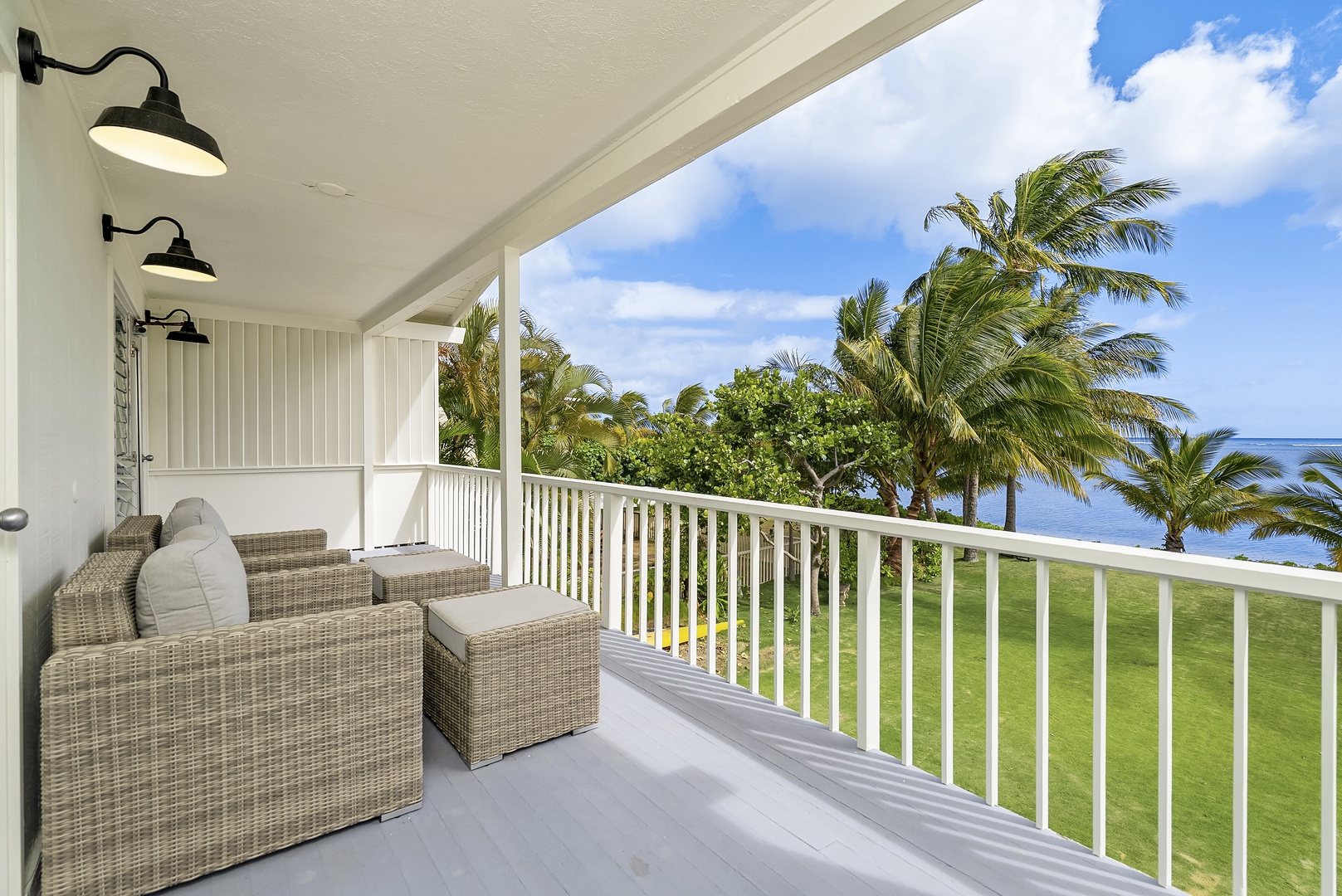 Honolulu Vacation Rentals, Honolulu Beachfront Retreat - Balcony with wicker seating and beautiful ocean views for ultimate relaxation.