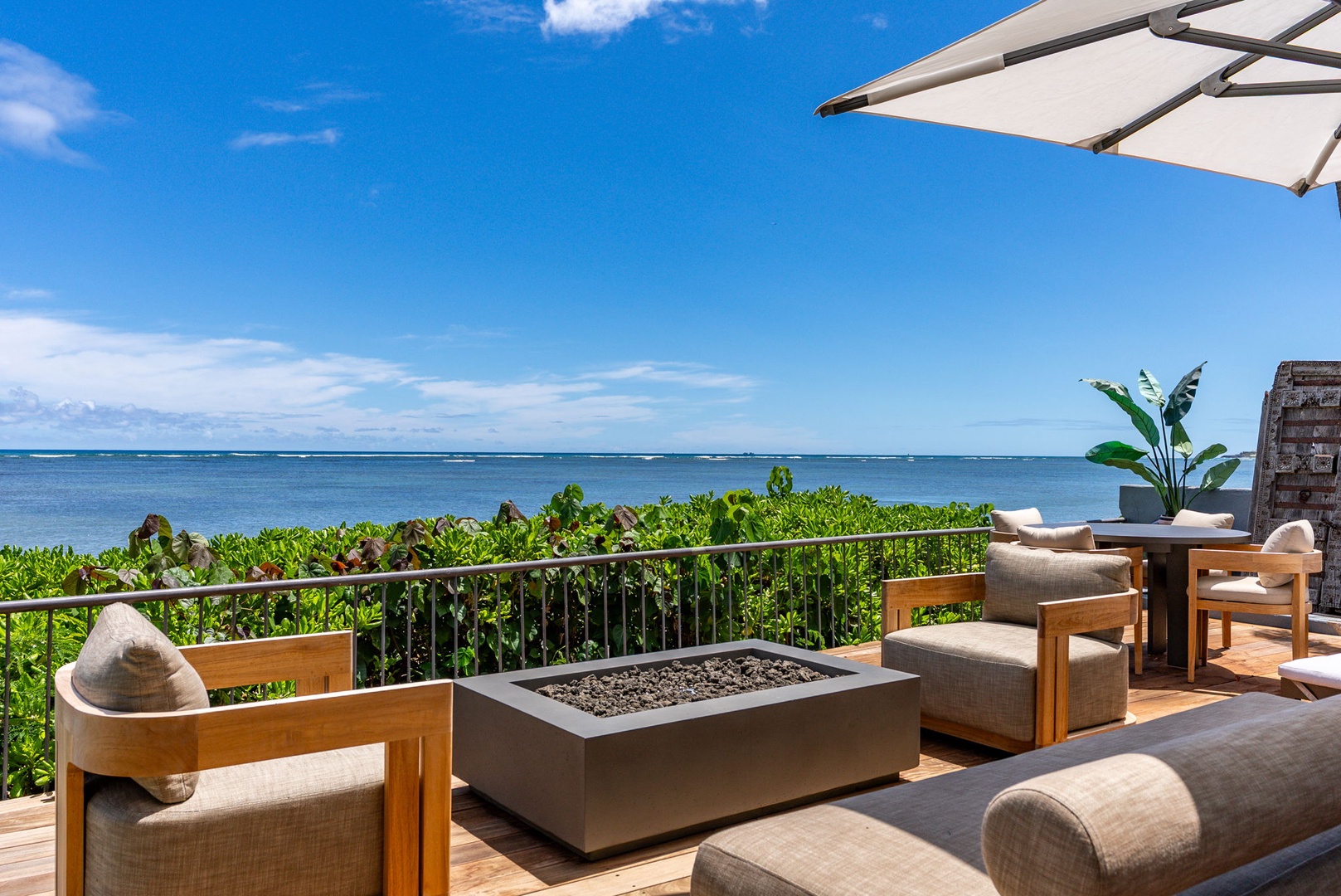 Honolulu Vacation Rentals, Wailupe Beachfront Getaway - Oceanfront deck at Wailupe Beachfront Getaway with fire pit lounge and panoramic reef views.