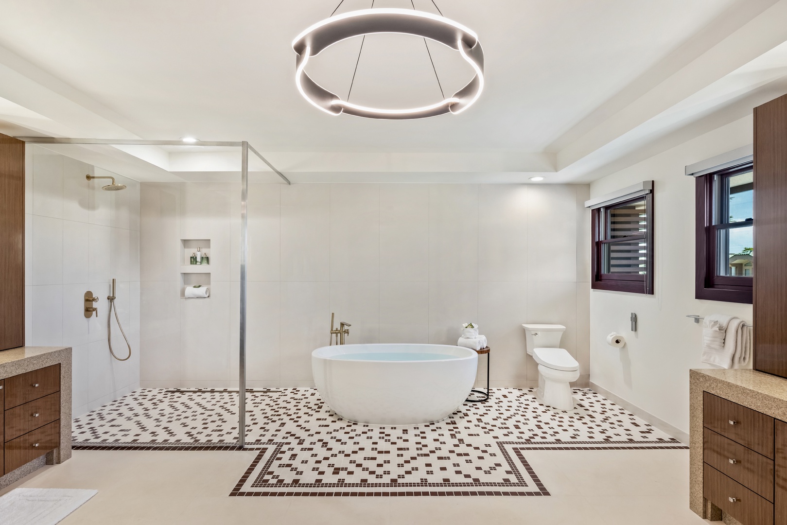 Honolulu Vacation Rentals, Kahala Grand Splendor - The primary ensuite features a beautiful soaker tub and a sleek glass shower for relaxation.