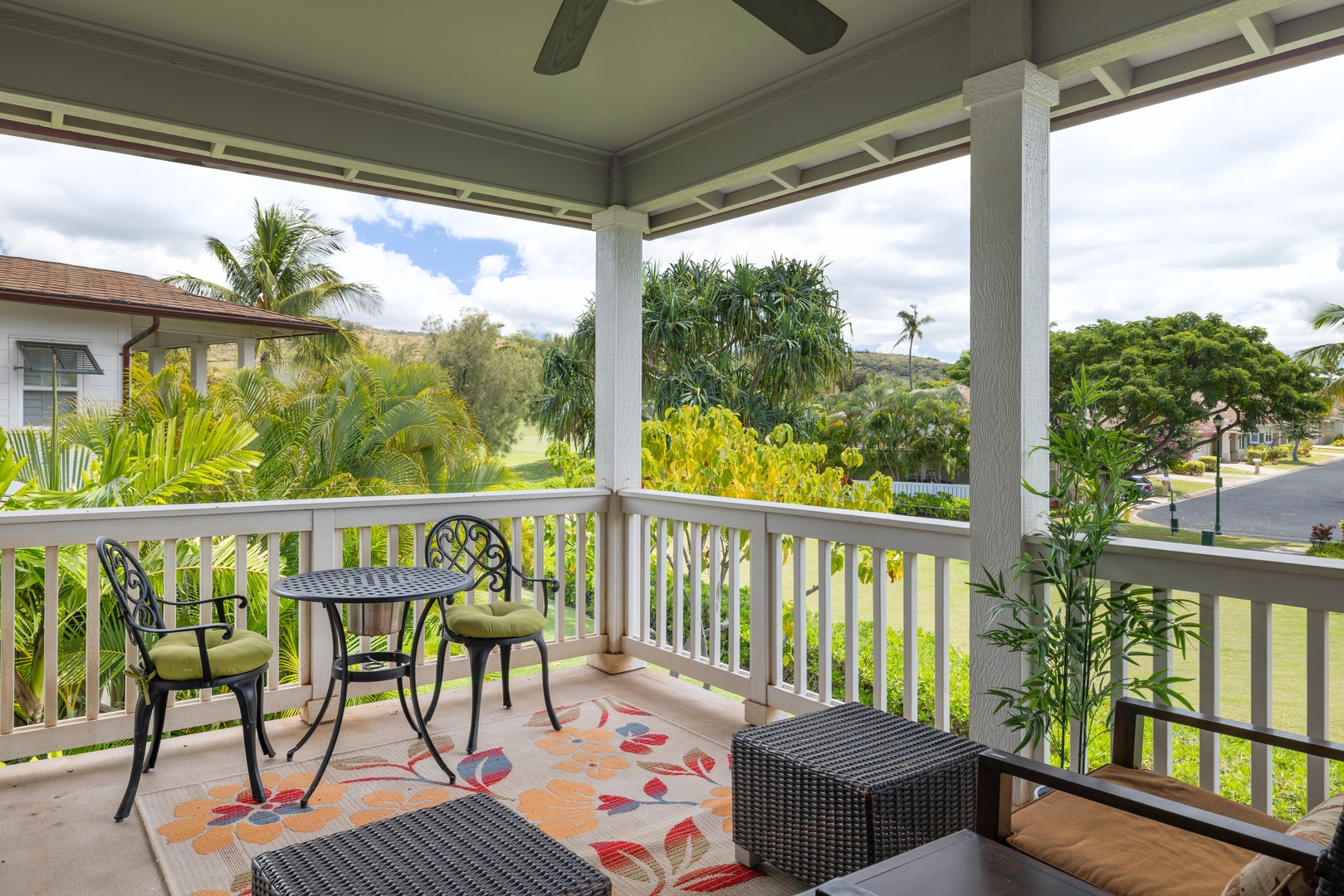 Kapolei Vacation Rentals, Coconut Plantation 1190-1 - The bedroom lanai with colorful prints and panoramic views.