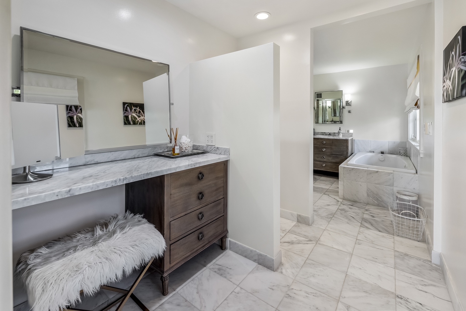 Honolulu Vacation Rentals, Moana Lani - Main House - Twin vanities plus a seated makeup counter, so nobody waits on the mirror before dinner.