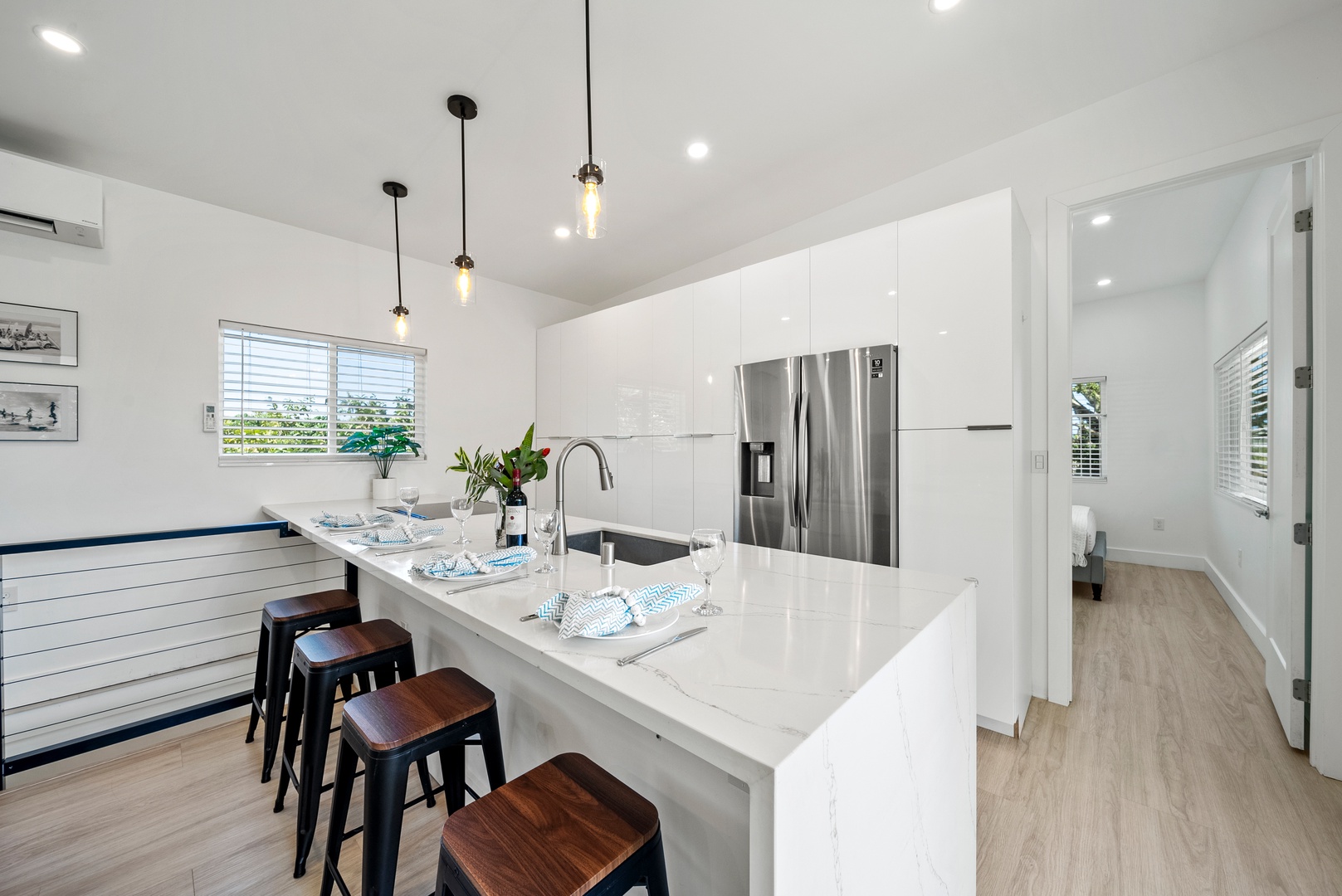 Haleiwa Vacation Rentals, Sunset Beach Island Retreat - Stainless steel appliances complement the clean, minimalist look, making this kitchen both functional and stylish.