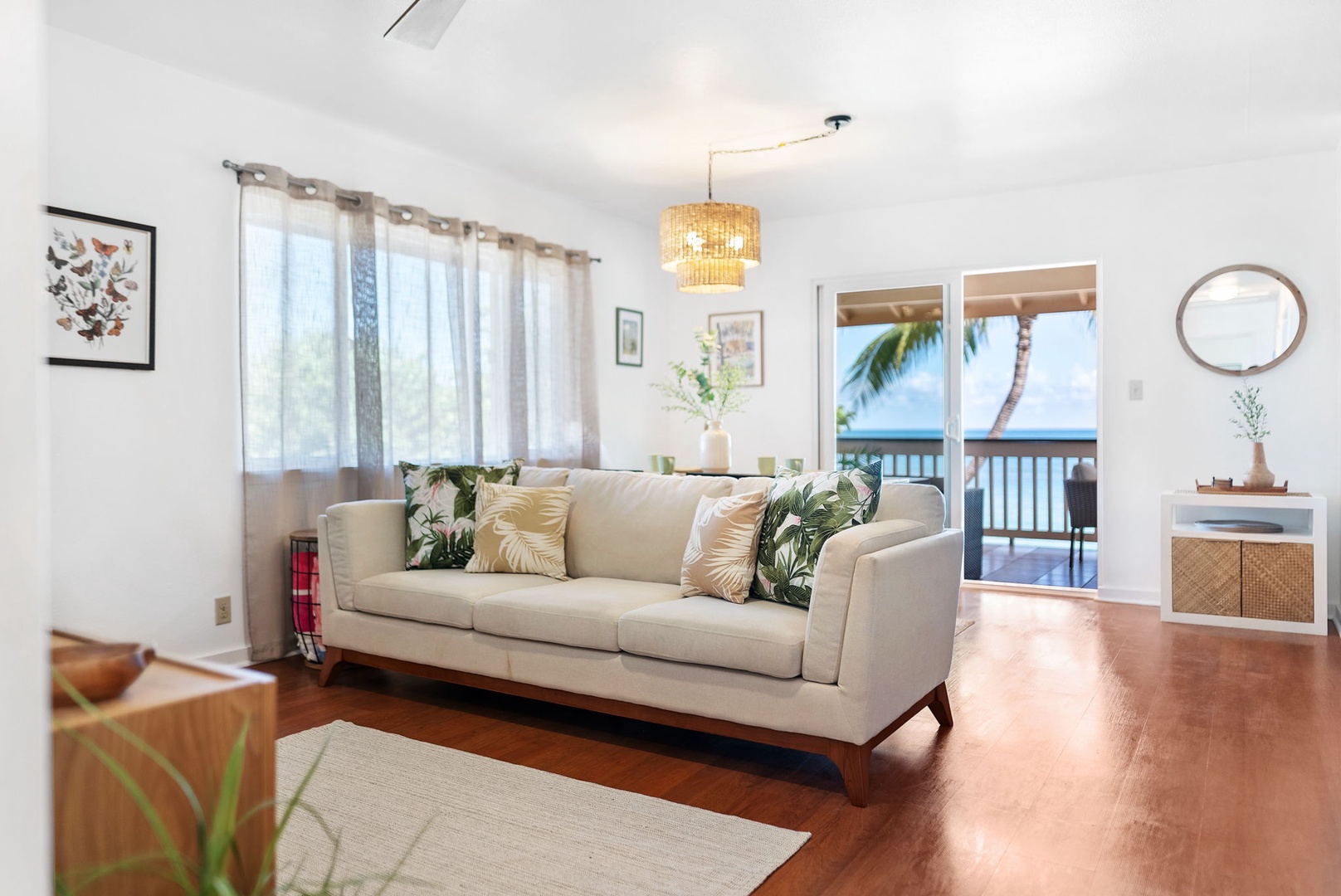 Haleiwa Vacation Rentals, Pikai Hale - The sliding doors behind the sofa lead out to your private lanai with beach views
