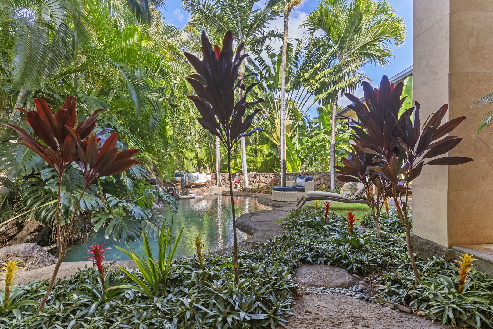 Honolulu Vacation Rentals, Pili Pono - Lush tropical landscaping surrounding the outdoor pool.