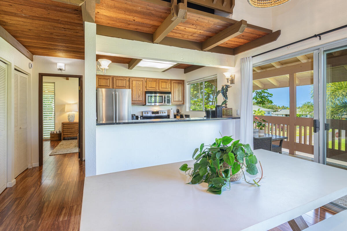 Princeville Vacation Rentals, Hale Ho'omaka - Kitchen from another angle showing modern cabinetry and openness.