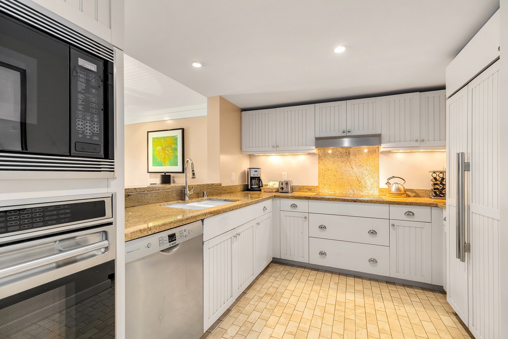 Kahuku Vacation Rentals, Turtle Bay Villas 112 - Chef's kitchen with high end appliances and built in refrigerator.