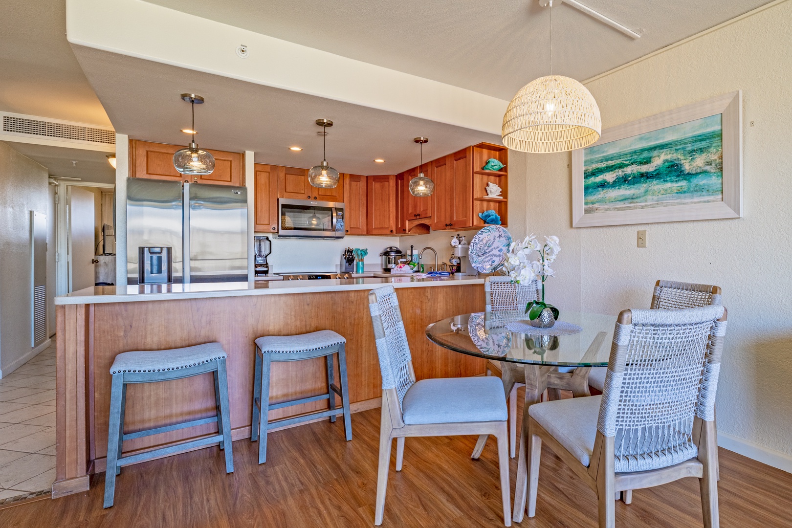 Lahaina Vacation Rentals, Kaanapali Shores 746 - The kitchen bar and dining area offer a comfortable spot for casual meals or gatherings.