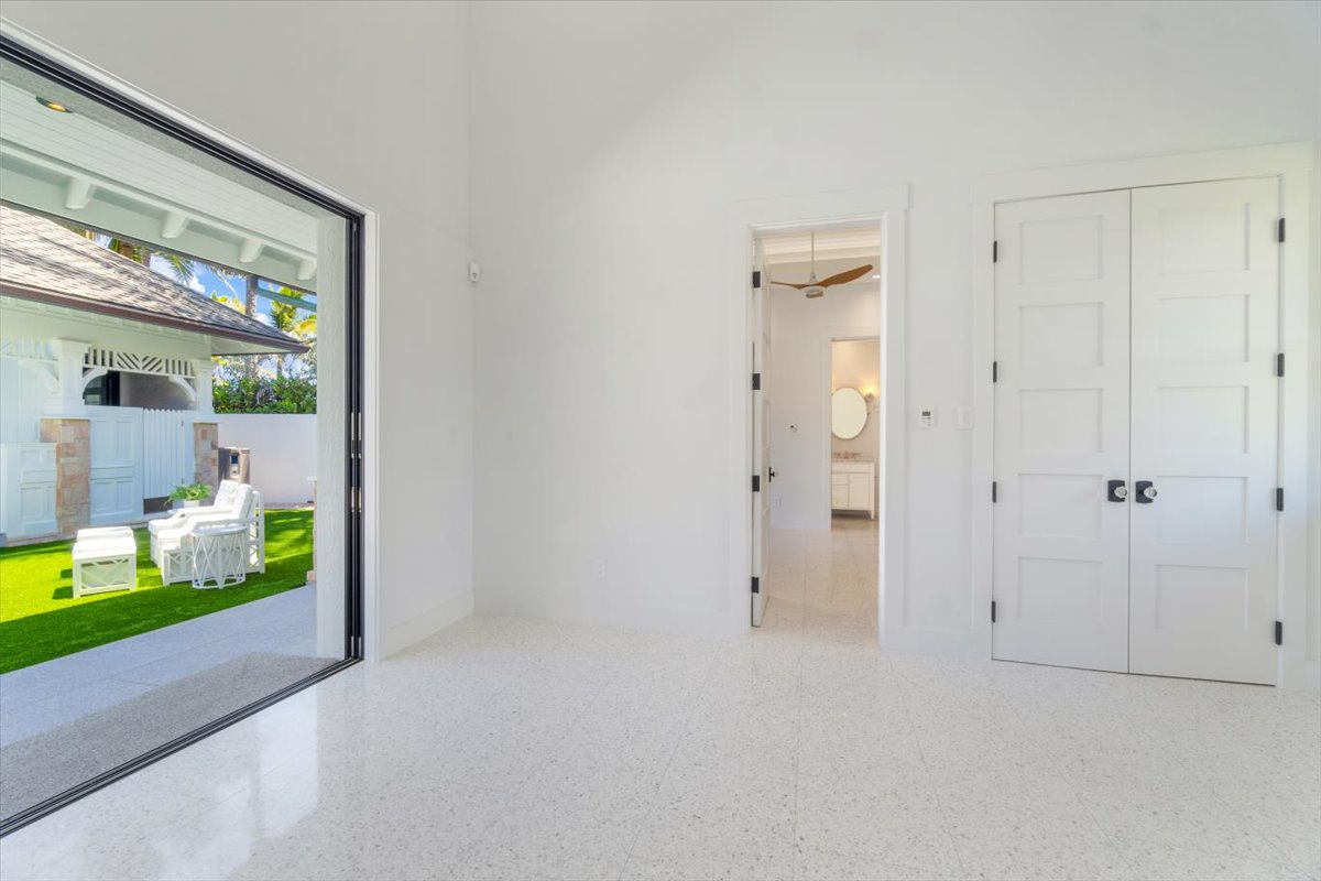 Kailua Vacation Rentals, Kailua Beachfront Estate - Spacious flex room with courtyard views and versatile potential for guests or work.