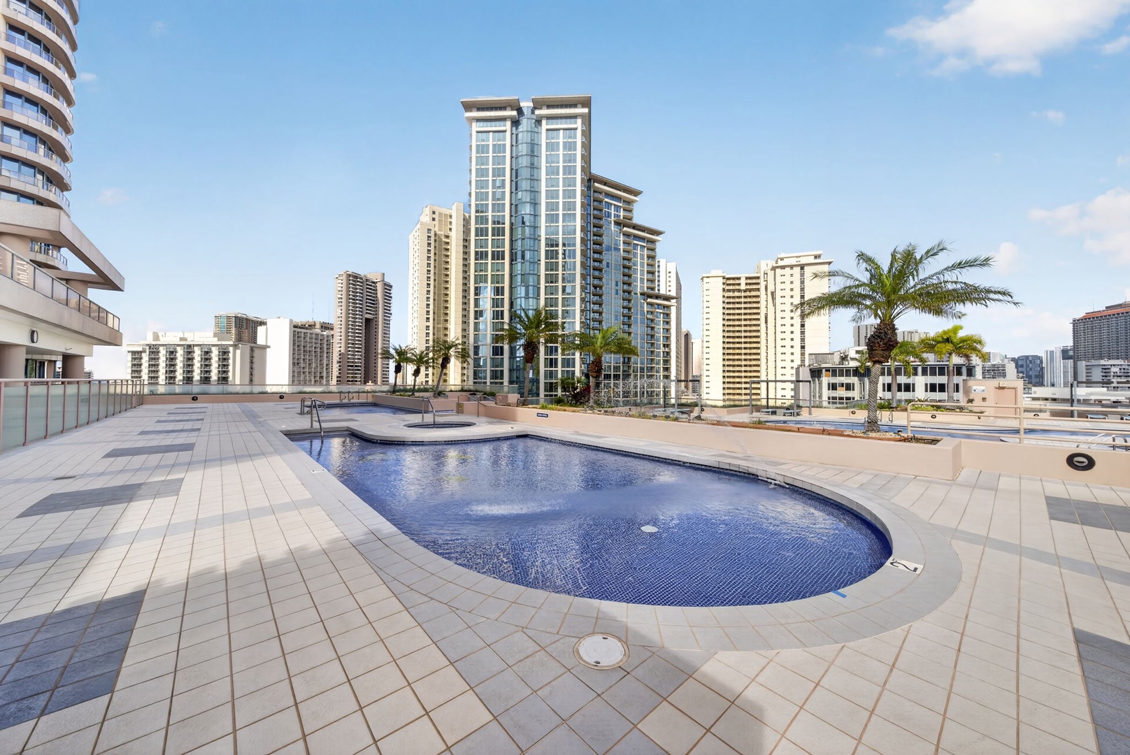 Honolulu Vacation Rentals, Island View at Waikiki Landmark - Unwind poolside with panoramic city views from Waikiki Landmark’s rooftop retreat.