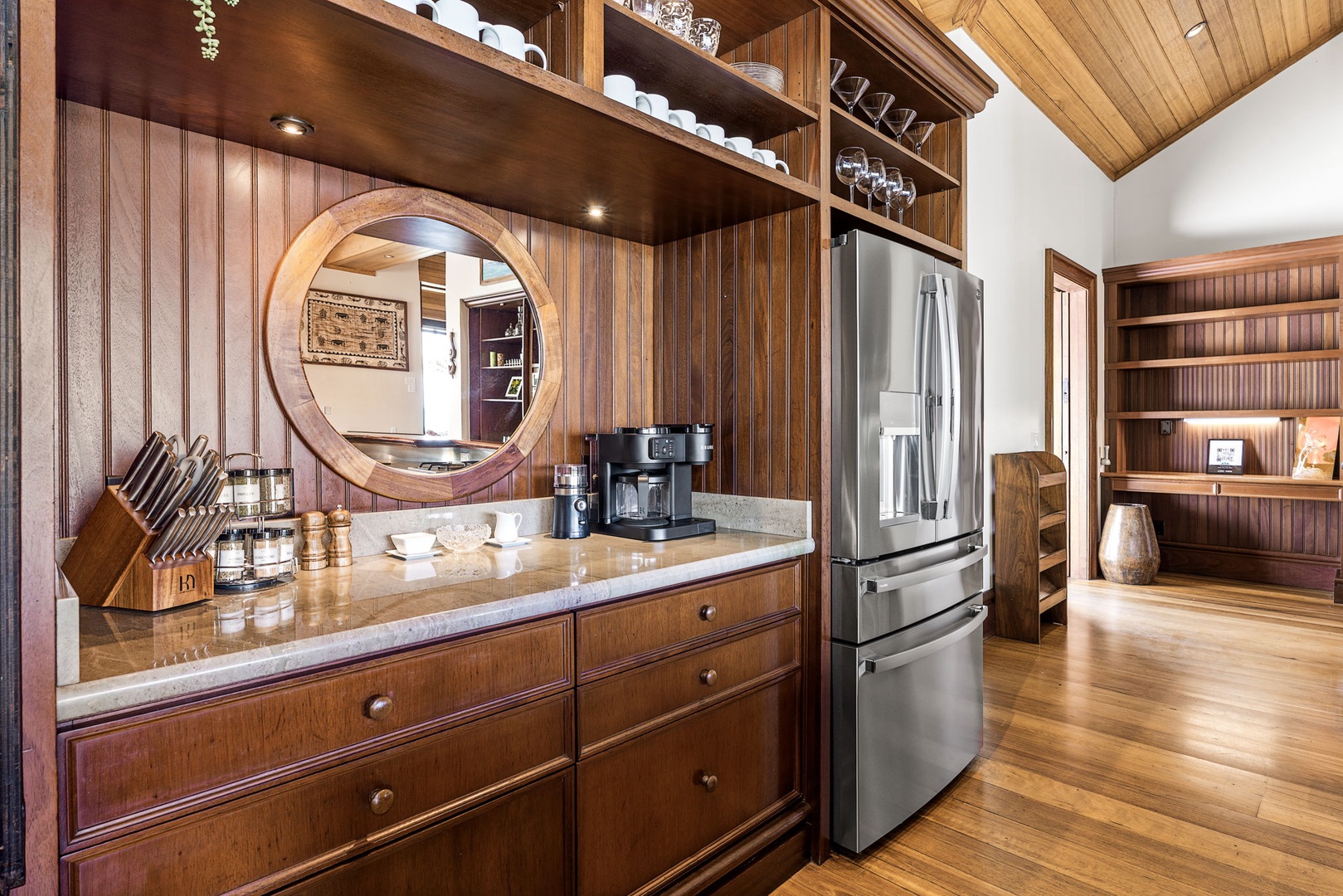 Kailua-Kona Vacation Rentals, Hahalua Bay Villa - Step into your beautiful kitchen featuring rich wood cabinetry, granite counters, and stainless appliances—perfect for preparing meals in style.