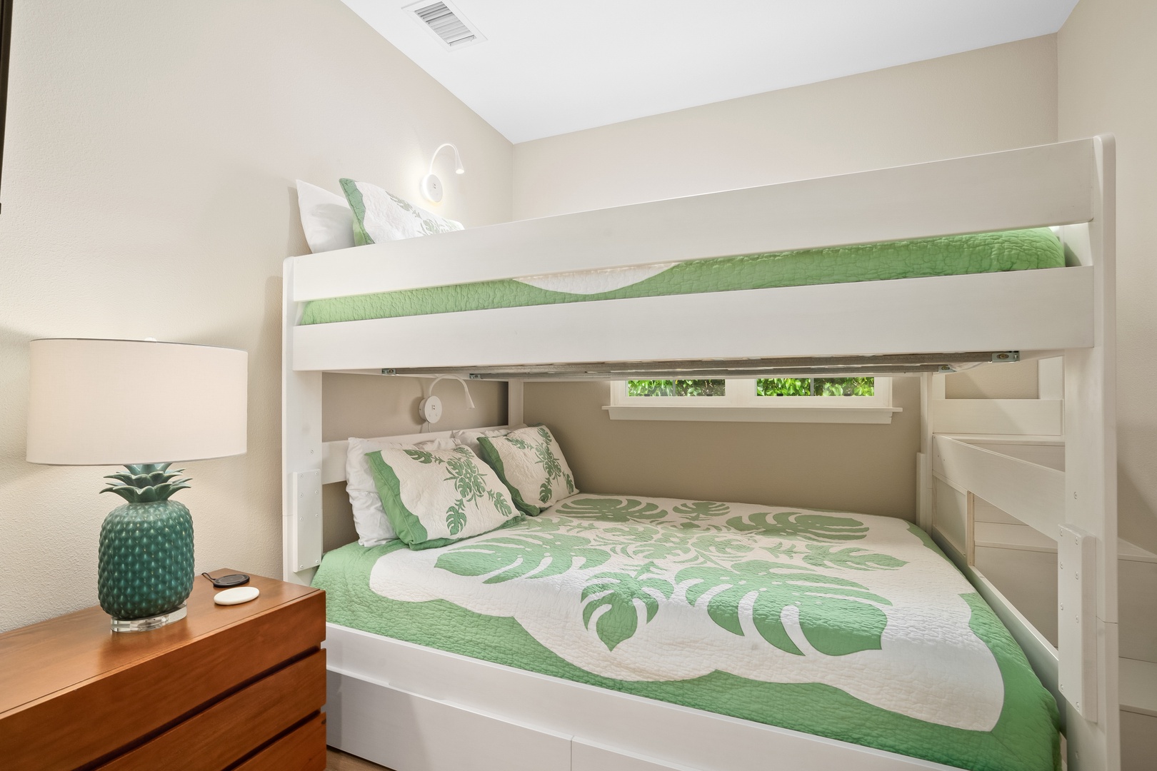 Princeville Vacation Rentals, Hale Kaua'i - The cheerful bunk room creates a cozy retreat for families and groups after island adventures.