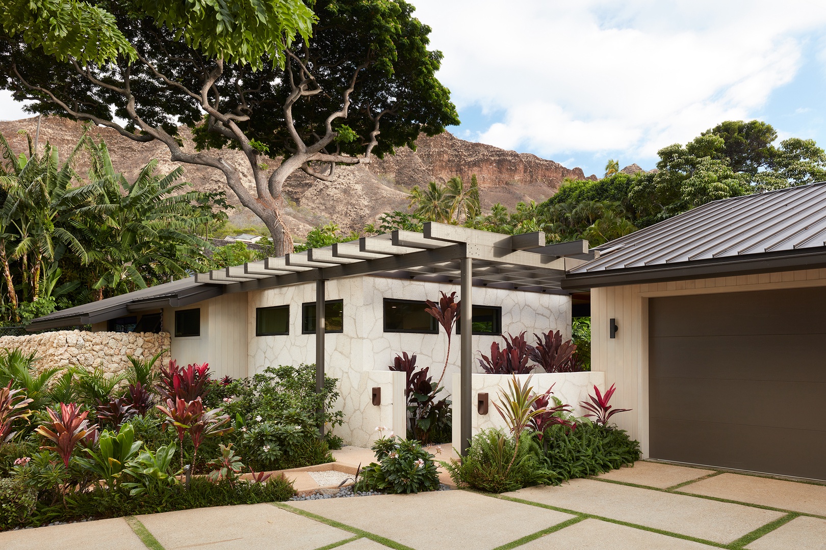 Honolulu Vacation Rentals, Diamond Head Hillside Estate** - Contemporary design, mature landscaping, and a peaceful residential setting come together to create an inviting island retreat.