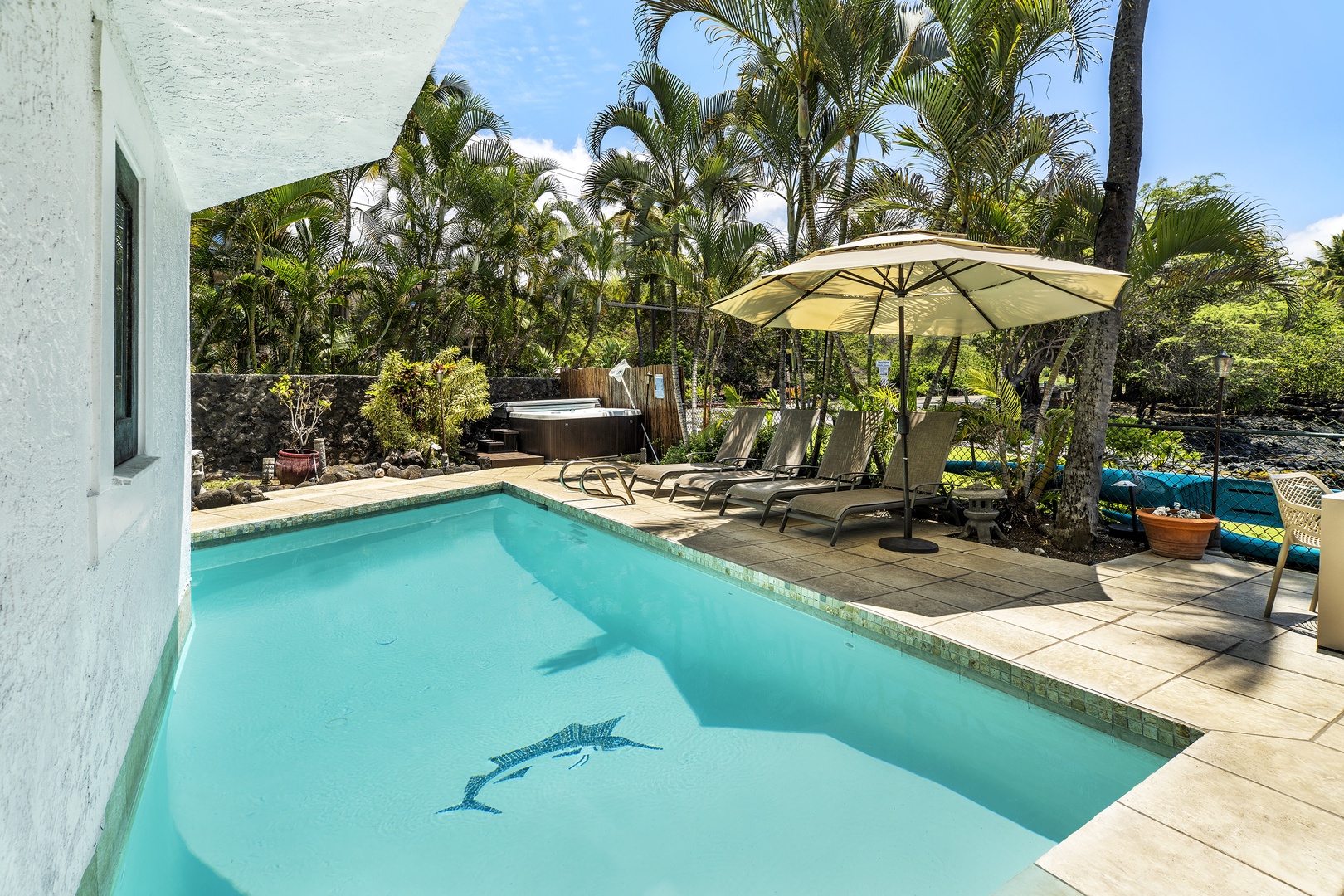 Kailua Kona Vacation Rentals, Kona's Shangri La - Soak in the solar-heated pool, relax in the hot tub, or read a book on one of the lounge chairs as palm trees sway nearby.