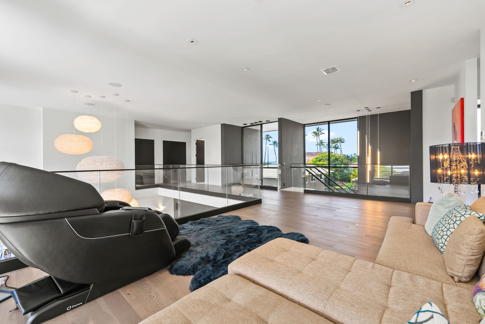 Honolulu Vacation Rentals, Ocean Villa 3 Bedroom - Light-filled lounge with expansive windows and a calm, open atmosphere.