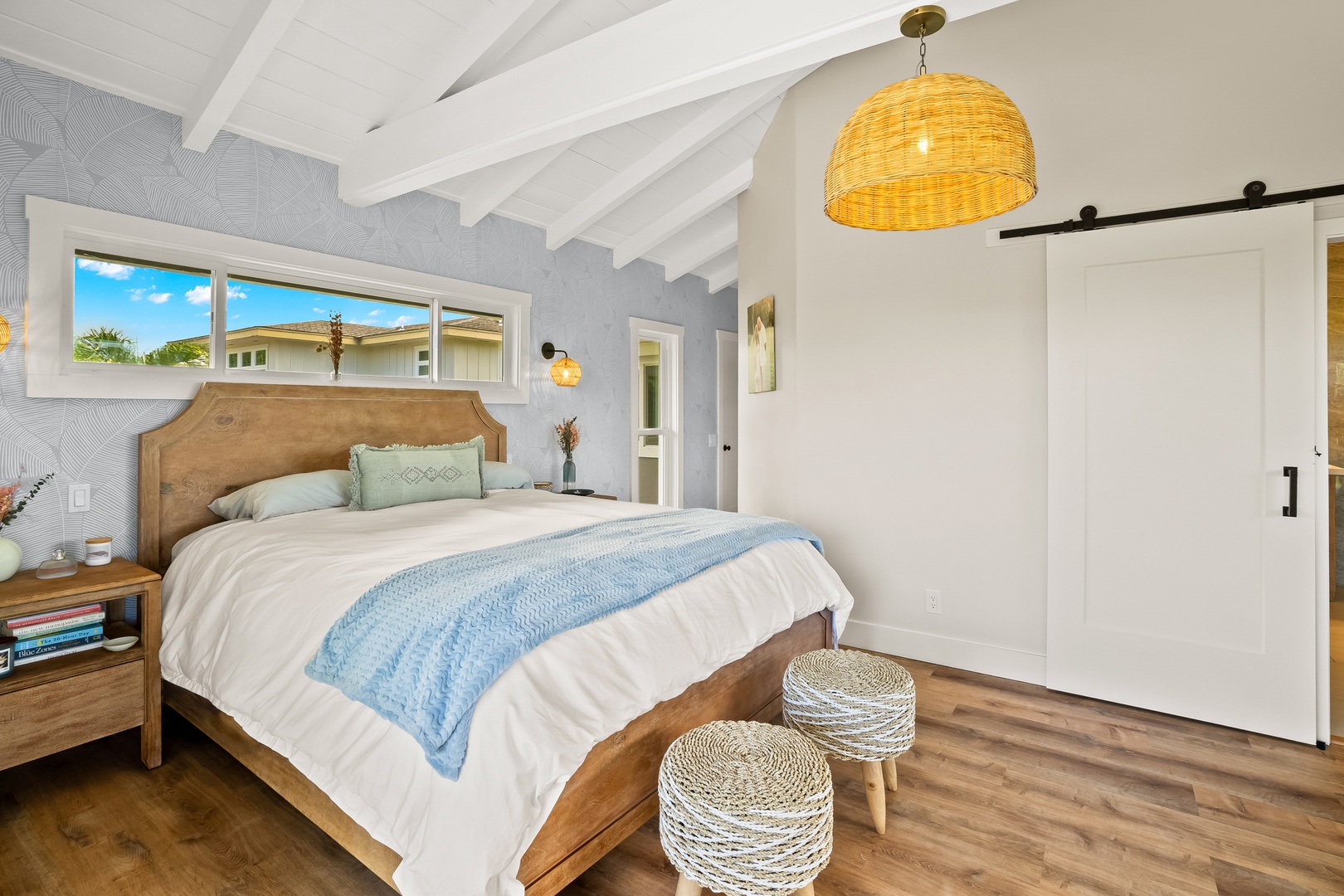 Princeville Vacation Rentals, Ola Hou - Main House - A charming bedroom with chic design and vibrant outdoor views for a refreshing stay.