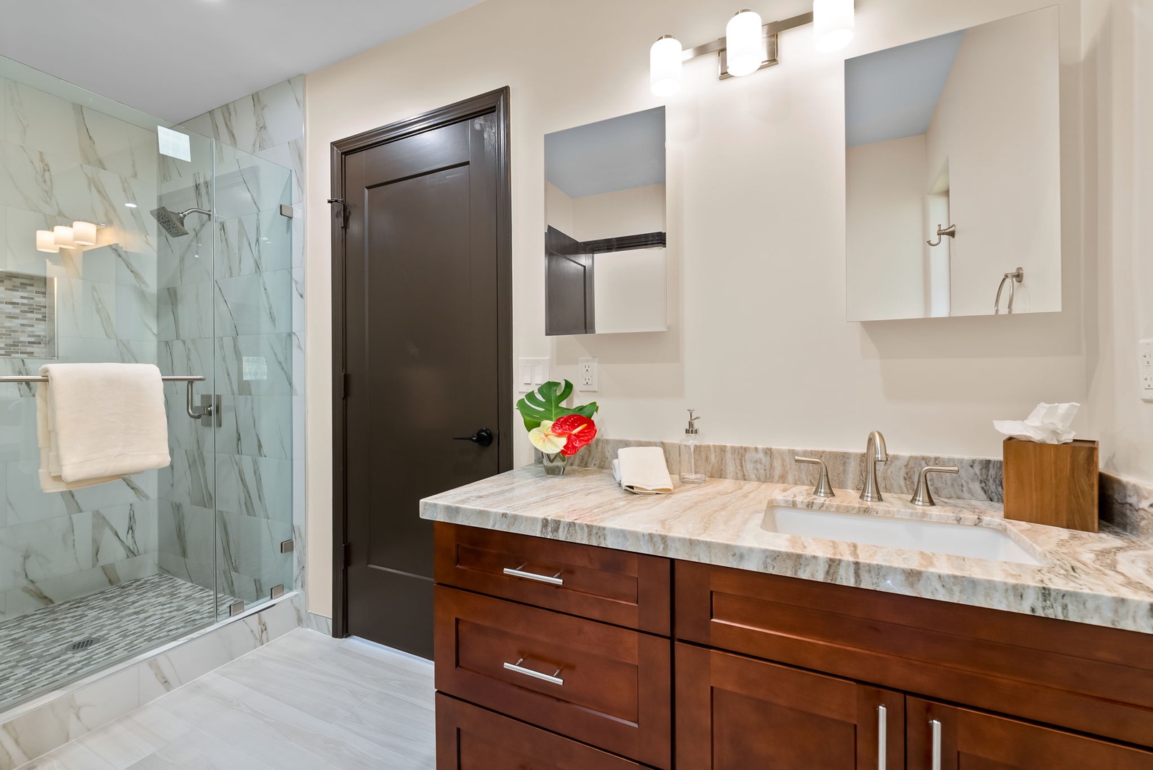 Honolulu Vacation Rentals, Kahala Zen - Sophisticated bathroom with marble details and a glass-enclosed shower.