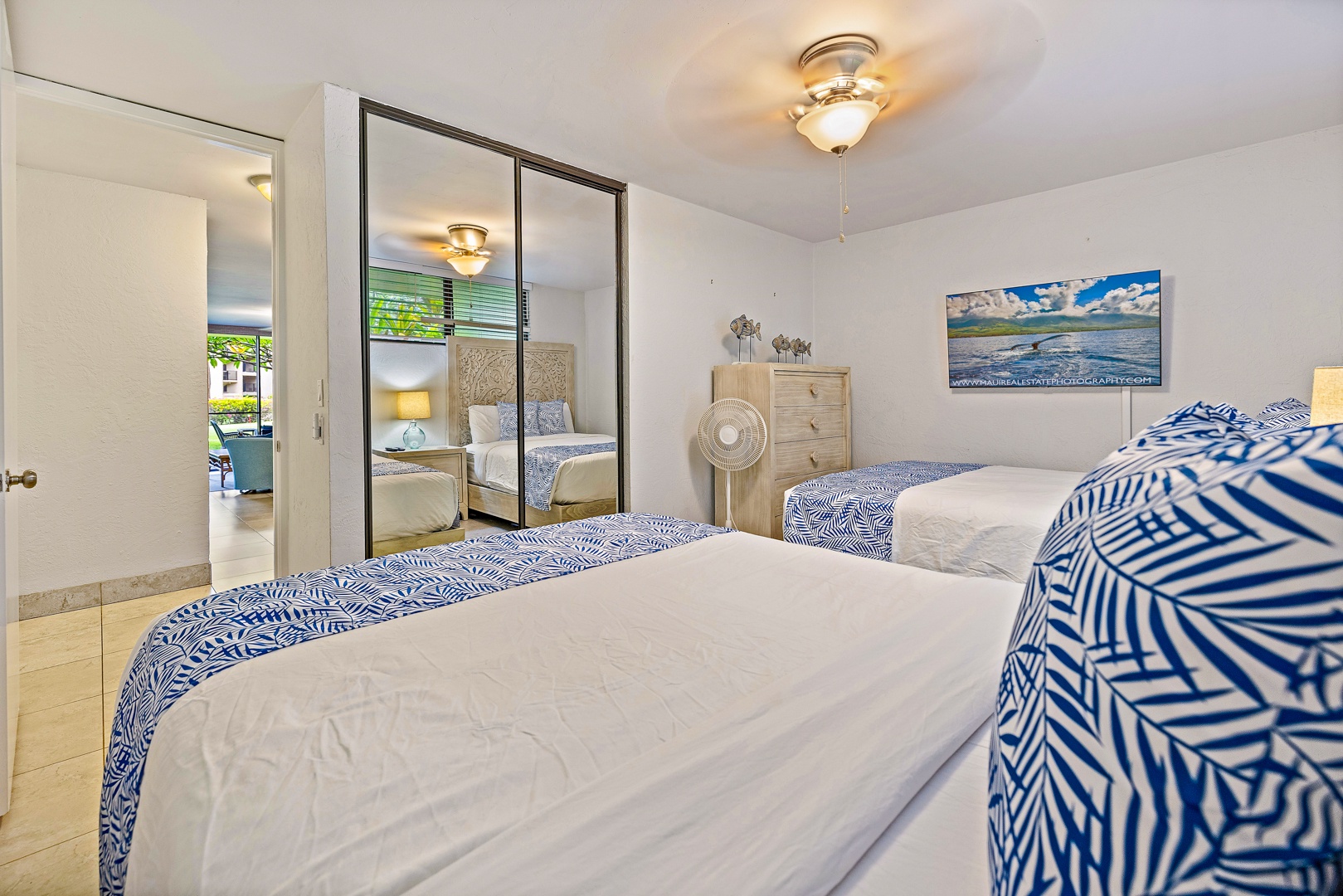 Lahaina Vacation Rentals, Papakea K-105 - The guest bedroom features two comfortable beds, mirrored closets, and plenty of storage