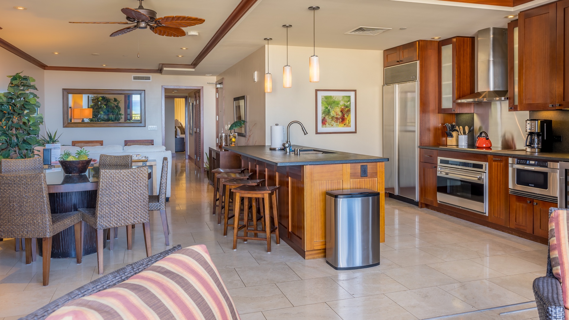 Kapolei Vacation Rentals, Ko Olina Beach Villas O704 - Breakfast bar seating at the kitchen and an open floor plan.