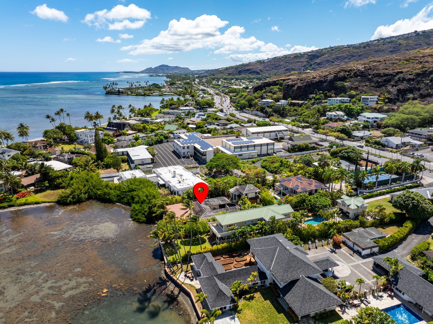 Honolulu Vacation Rentals, Honolulu Lagoonfront Villa - Zoomed aerial shows proximity to the lagoon, beach access, and lush residential surroundings—an Oahu hidden gem.