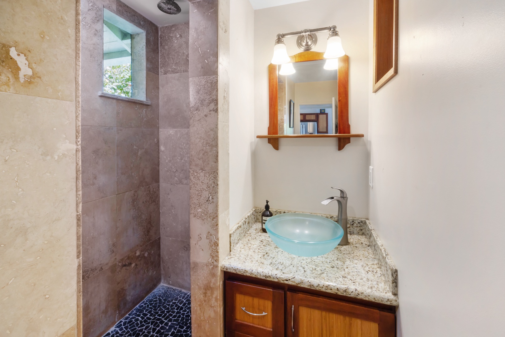 Kahuku Vacation Rentals, Hale Pellicano - The ensuite bathroom featuring the single vanity and separate shower.