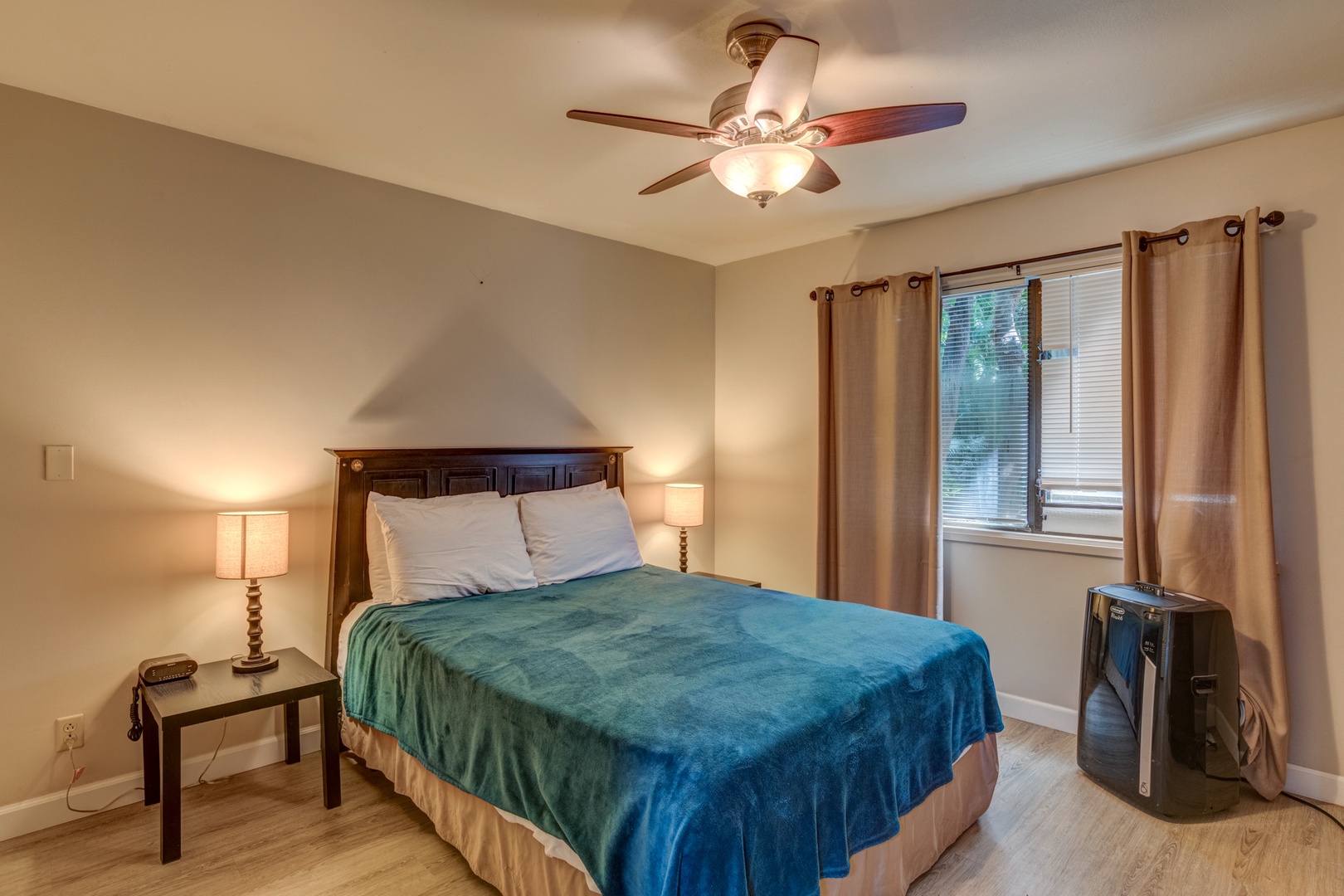 Kihei Vacation Rentals, Koa Resort 1B - Tranquil bedroom with a king-sized bed, ceiling fan, and soft lighting for restful nights.