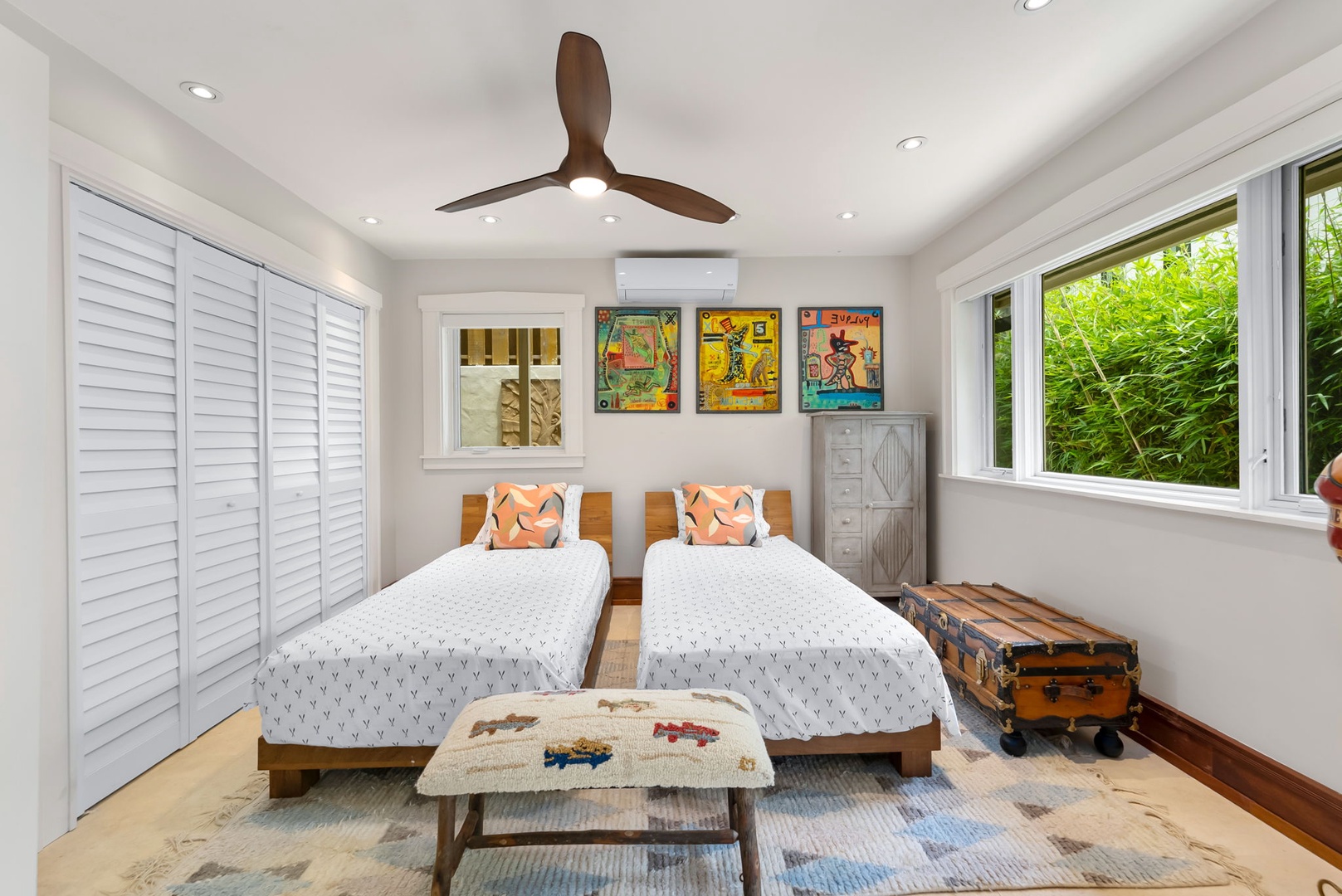 Kailua Vacation Rentals, Leaf House - Relax in this bright twin bedroom where natural light and tropical views through large windows create your peaceful retreat. Vintage-inspired art and unique furnishings add character to your stay.