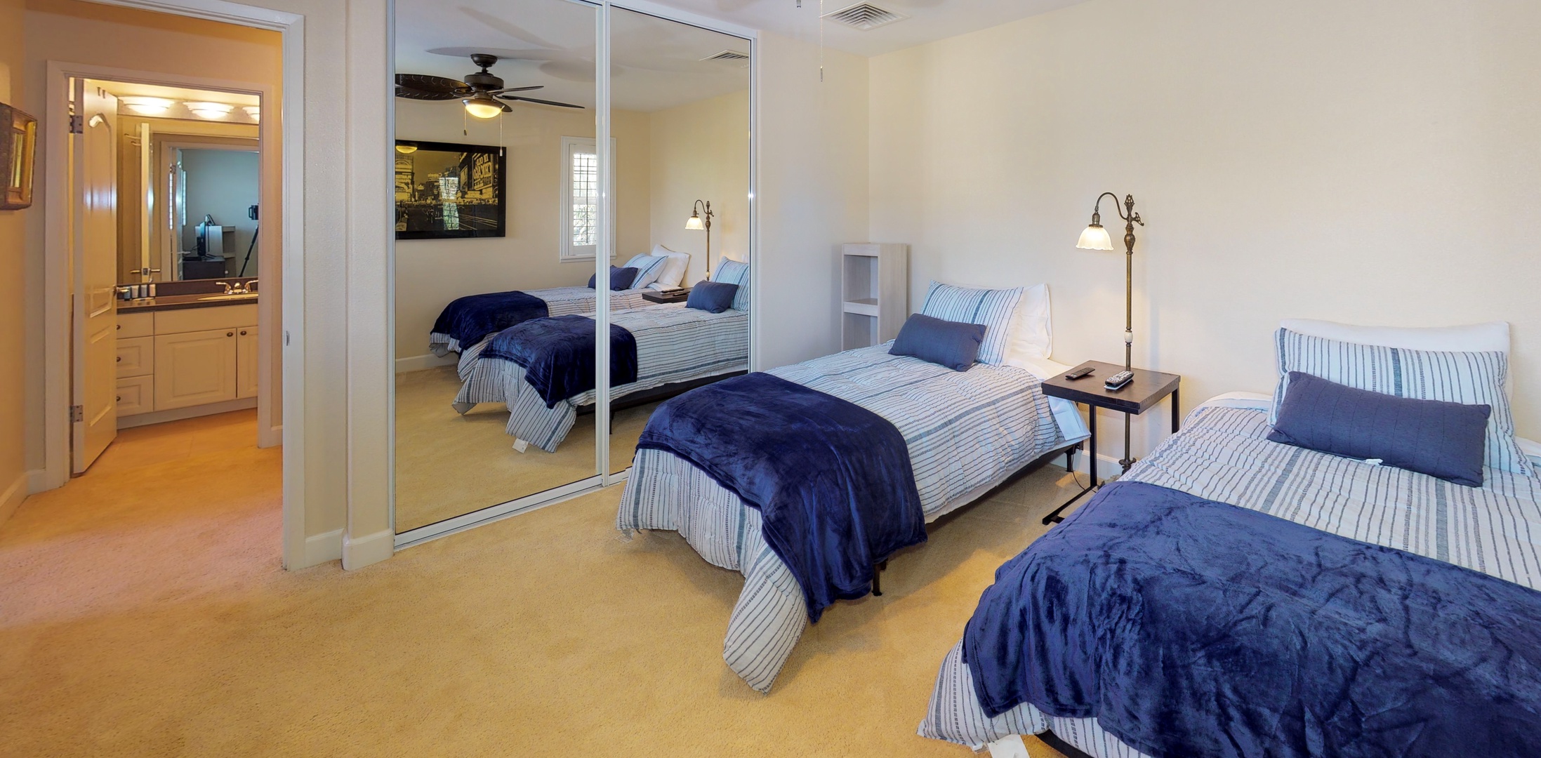 Kapolei Vacation Rentals, Ko Olina Kai 1065E - The third guest bedroom with large mirrors and soft linens.