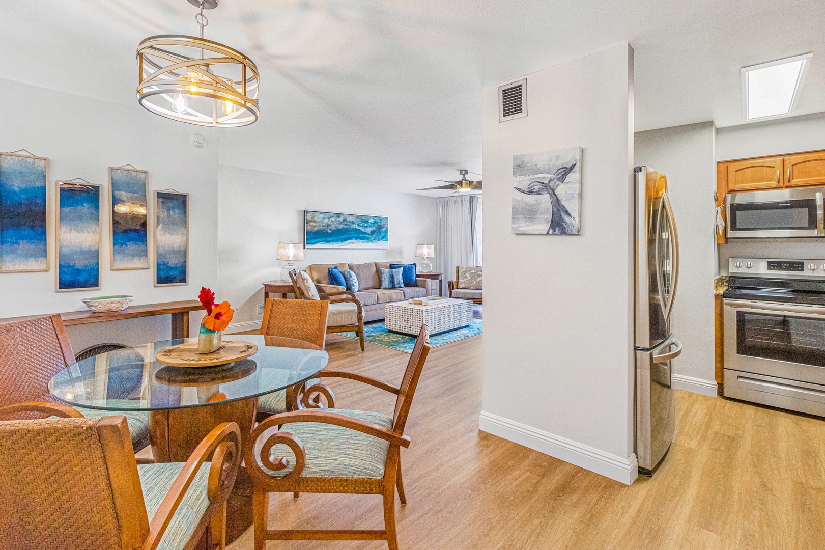 Lahaina Vacation Rentals, Royal Kahana 213 - The dining area and living room blend seamlessly in this open-concept space, creating a welcoming environment for shared meals and relaxation.