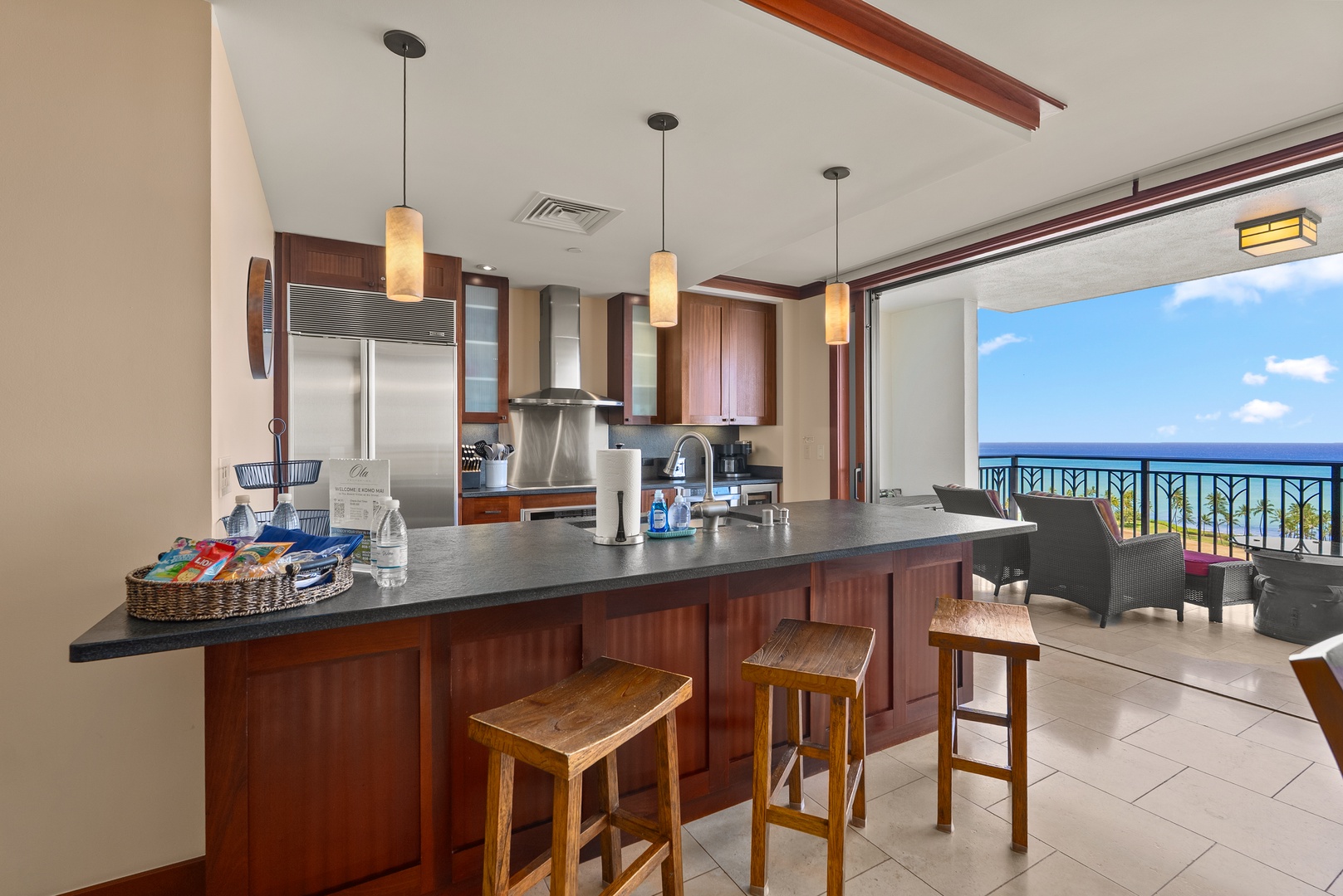 Kapolei Vacation Rentals, Ko Olina Beach Villas O1404 - Pull up a stool at the breakfast bar, ocean in view while dinner comes together.