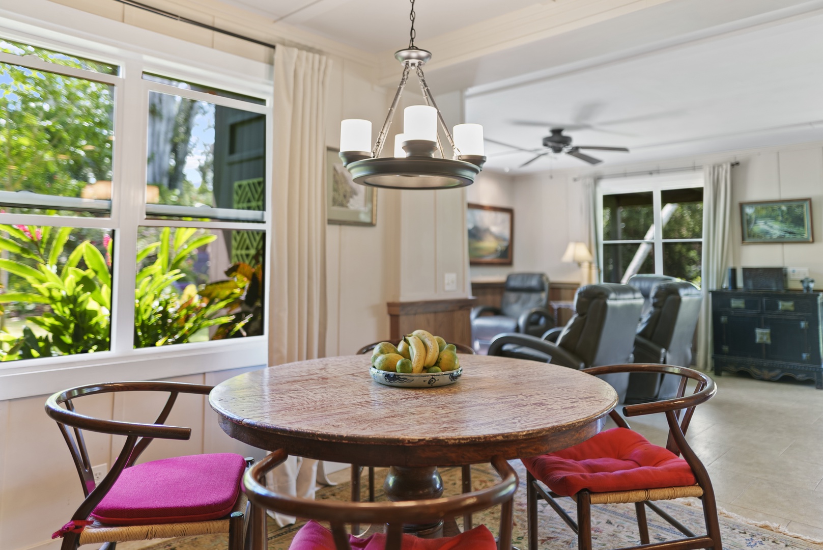 Haleiwa Vacation Rentals, Hale Anahulu - Dining area opens to living room and has views of the lush, tropical garden