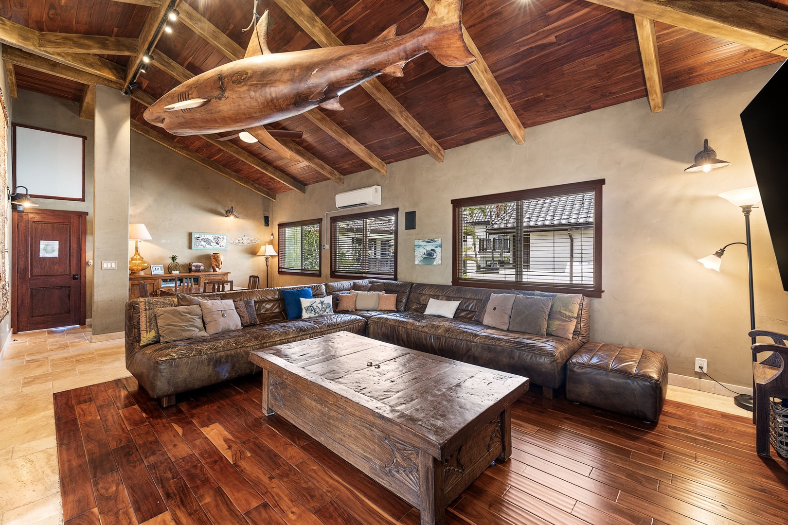 Kailua Kona Vacation Rentals, Mermaid Cove - Another angle of the media space with oversized sofa, rich wood finishes, and dramatic island lighting.