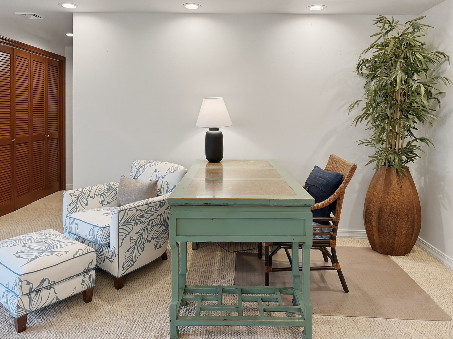 Honolulu Vacation Rentals, Maunalua Estate - Your stylish work area features a vintage turquoise desk, tropical-print chair, and cozy reading nook with natural light.