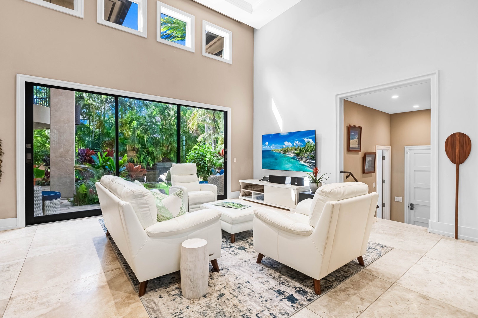 Honolulu Vacation Rentals, Pili Pono - Relax in the main living room with garden views and soaring vaulted ceilings.