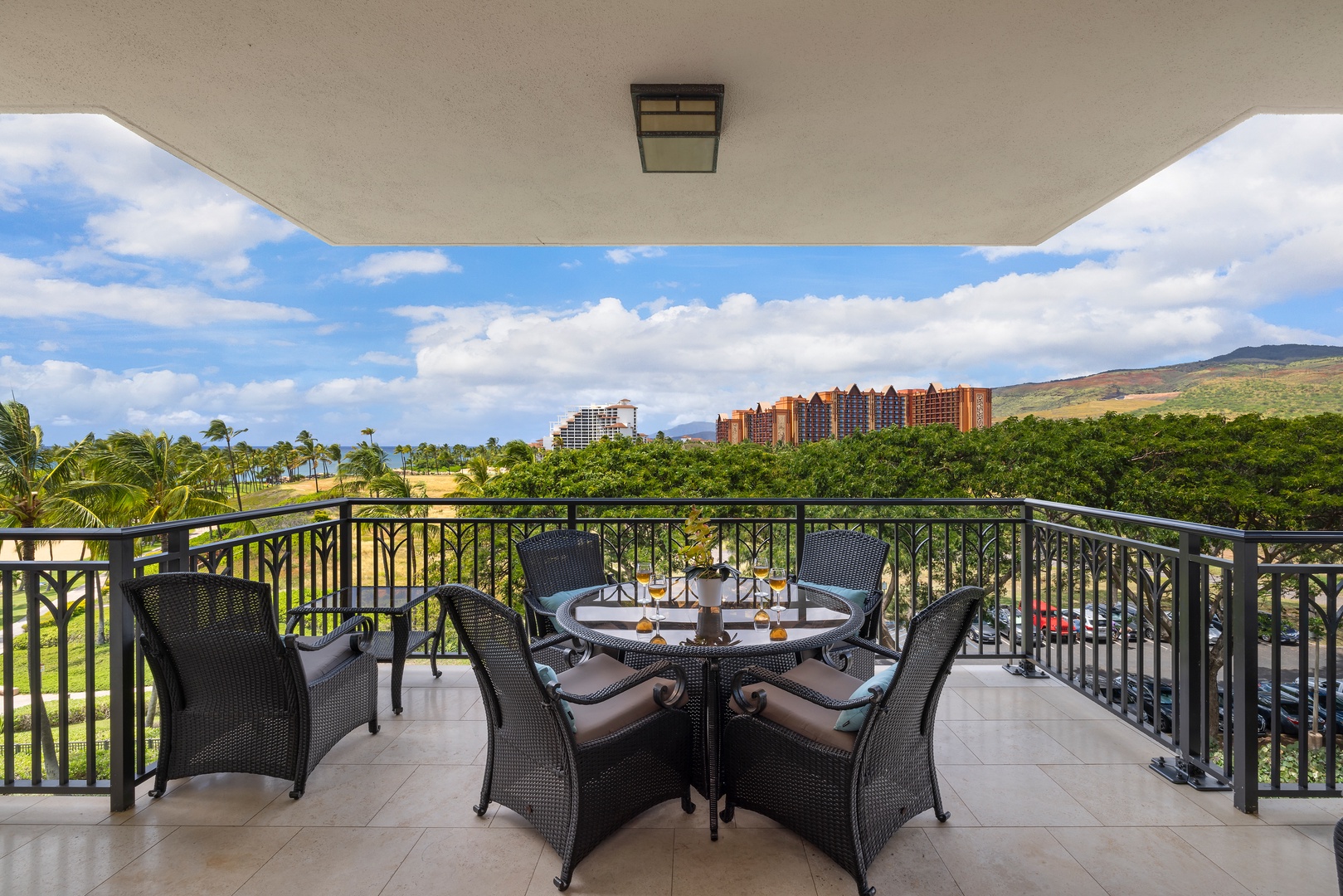 Kapolei Vacation Rentals, Ko Olina Beach Villas B506 - Savor your morning coffee on this covered lanai with sweeping views of lush landscapes and distant resort towers.