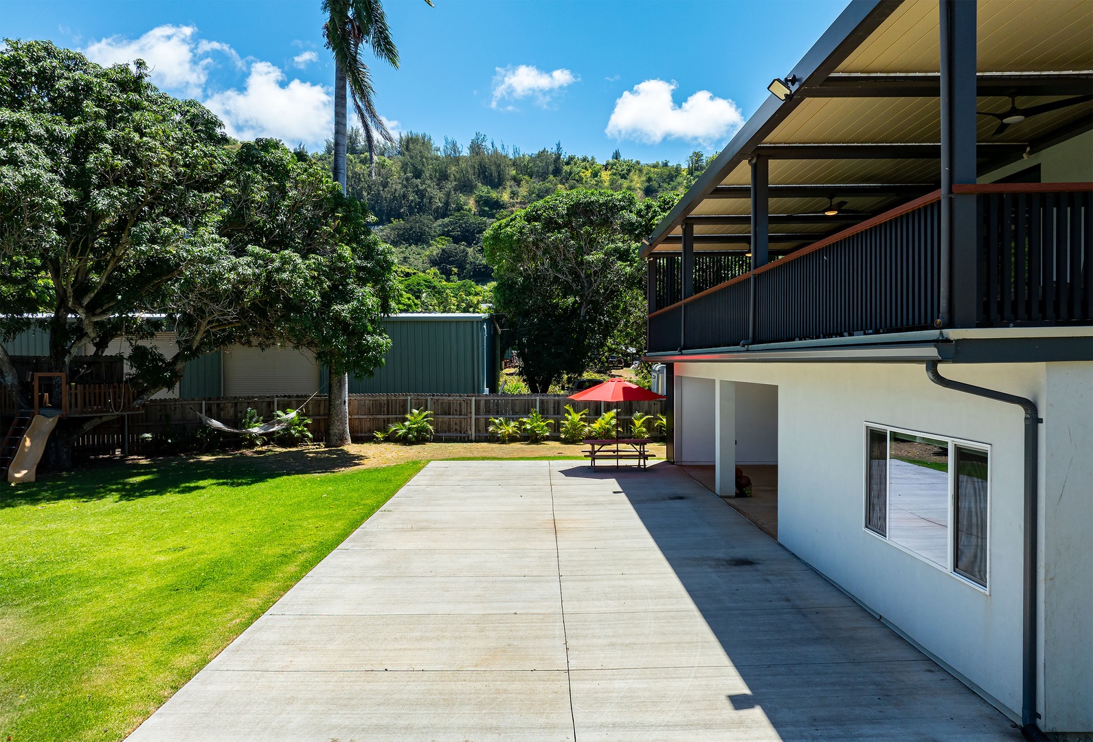 Haleiwa Vacation Rentals, Sunset Beach Island Retreat - This modern two-story home offers a spacious layout with a large covered balcony, perfect for outdoor dining or relaxing with a view.