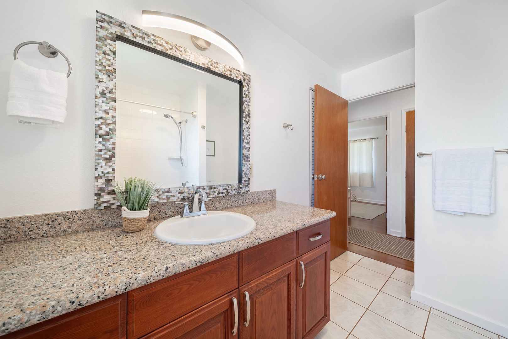 Haleiwa Vacation Rentals, Pikai Hale - The full guest bathroom has a single vanity/sink and plenty of storage