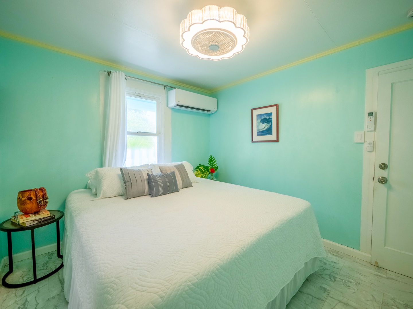 Hauula Vacation Rentals, Private Beach Paradise - Drift into peaceful dreams in your serene mint-green bedroom, where soft natural light and coastal vibes create the perfect retreat.