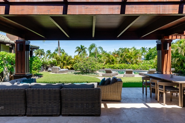 Kamuela Vacation Rentals, Canoe House & Beach Walker at Champion Ridge - Spacious covered outdoor seating area with views of the pool and lush tropical garden