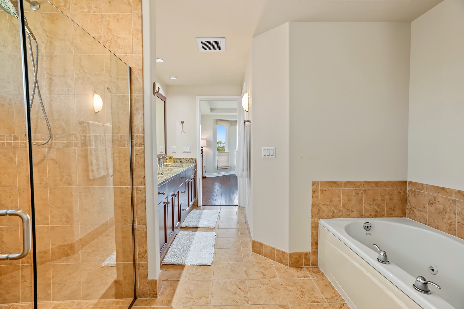 Princeville Vacation Rentals, Hale Hau'oli Moku - Rinse off the beach in the glass shower, or run a bath in the tub beside it.