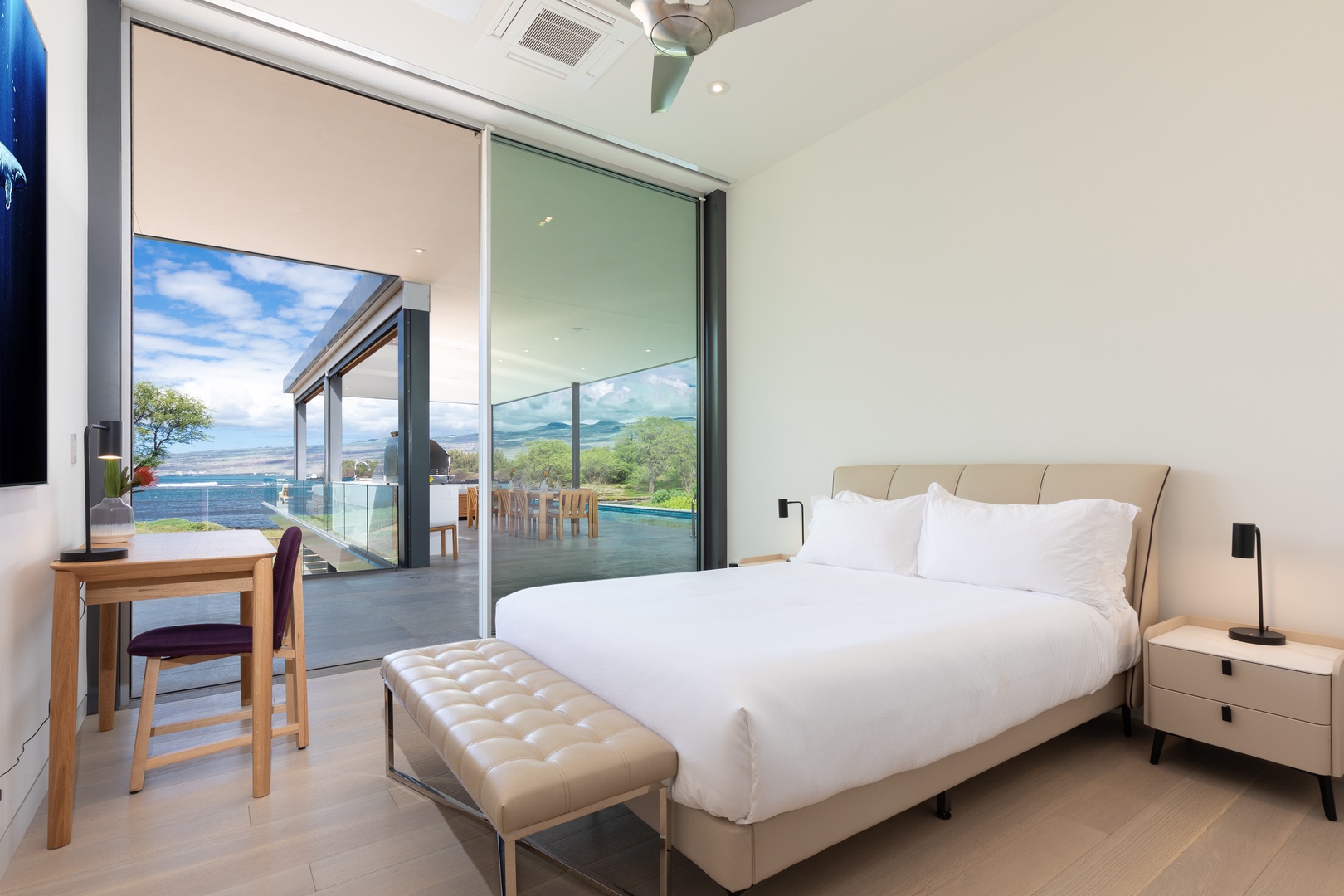 Kamuela Vacation Rentals, 5BD Estate Home at Puako Bay (P50) - Luxurious guest bedroom with expansive glass doors leading to the lanai, offering stunning views.