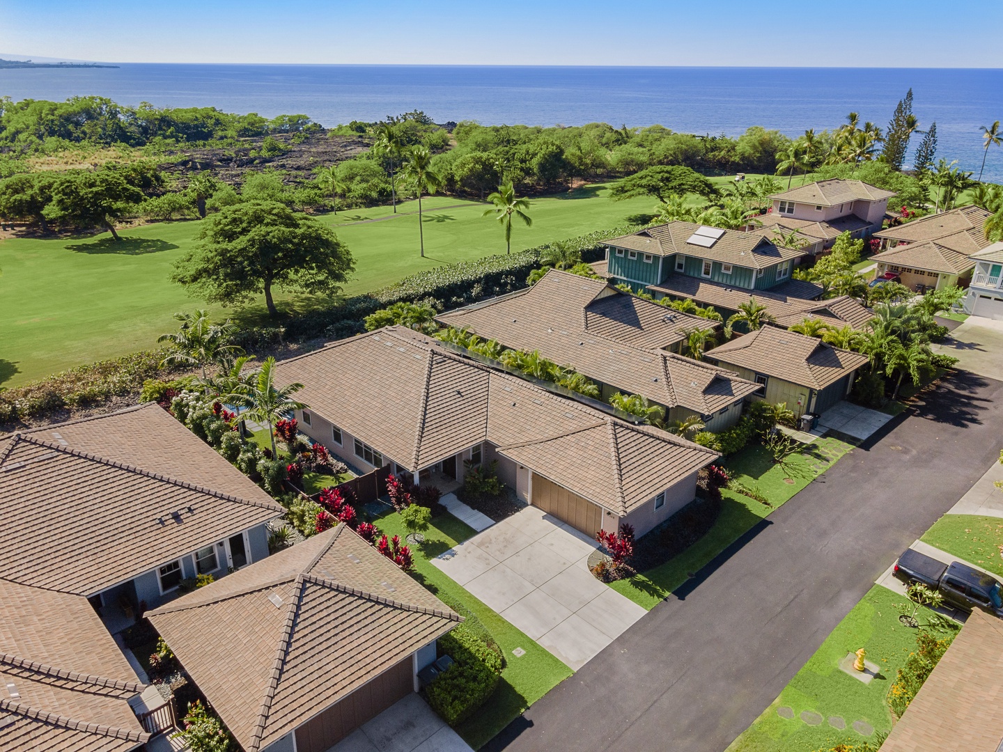 Kailua Kona Vacation Rentals, Kona Blue Vacations Holua Kai - Aerial view shows Holua Kai’s peaceful, low-density layout tucked above the sparkling Kona coast.
