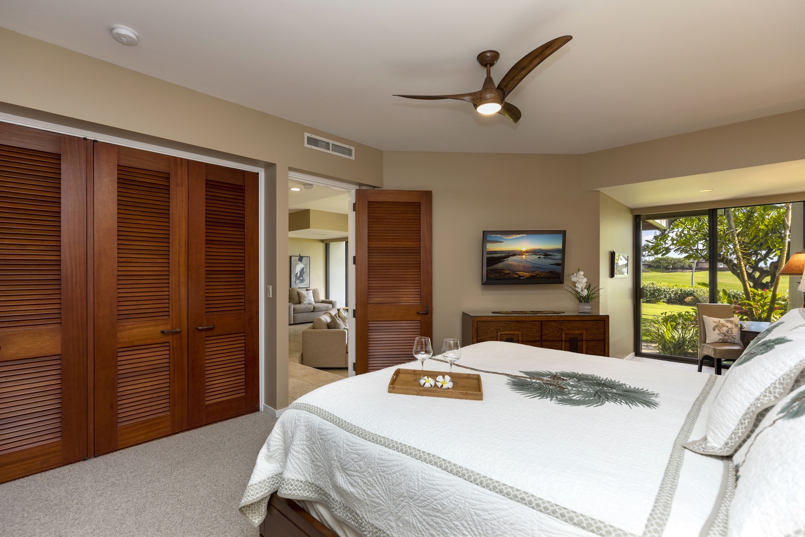 Kamuela Vacation Rentals, Mauna Lani Point E105 - The primary bedroom is very spacious and luxurious.