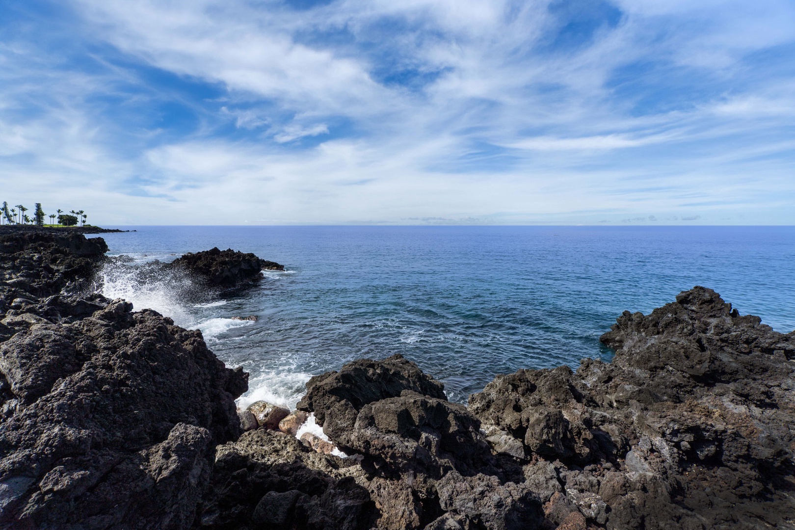 Kailua Kona Vacation Rentals, Keauhou Kona Surf & Racquet 1104 - The lava shoreline runs right along the grounds where the surf keeps rolling in.