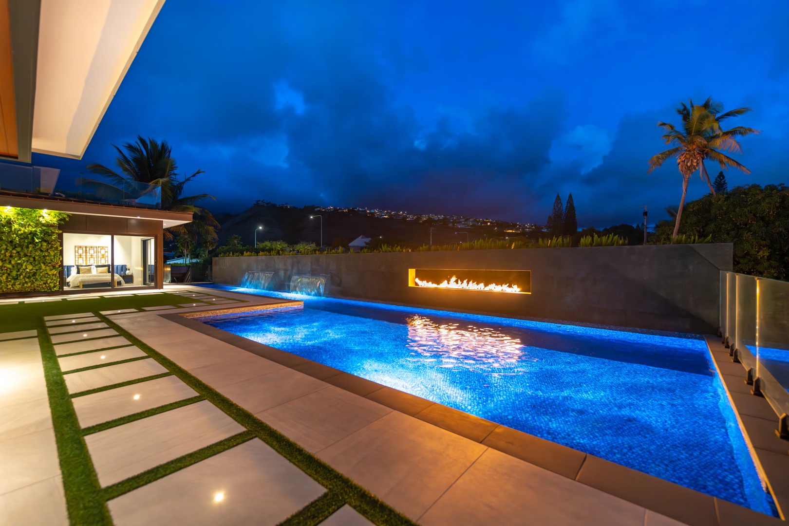 Honolulu Vacation Rentals, Ocean Villa Emilie - After sunset, the infinity pool glistens beside the fire feature—inviting you to soak, unwind, and savor the ambiance.
