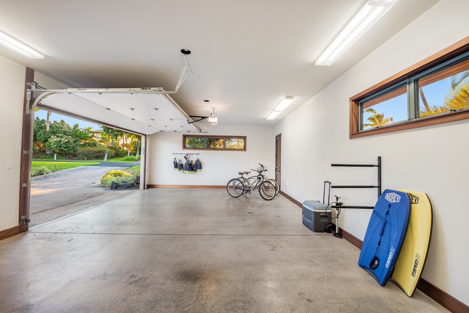 Kamuela Vacation Rentals, Champion Ridge Oasis - Spacious two-car garage featuring neatly stored sports equipment and secure parking.