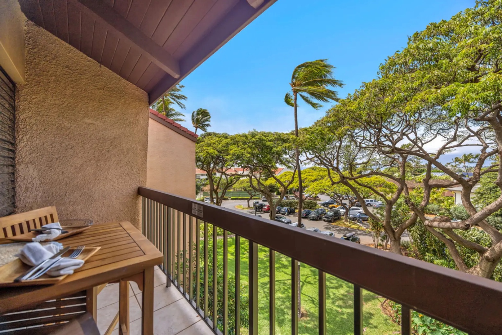 Kihei Vacation Rentals, Maui Vista 2420 - Take breakfast out to the lanai, branches and swaying palms filling the view.