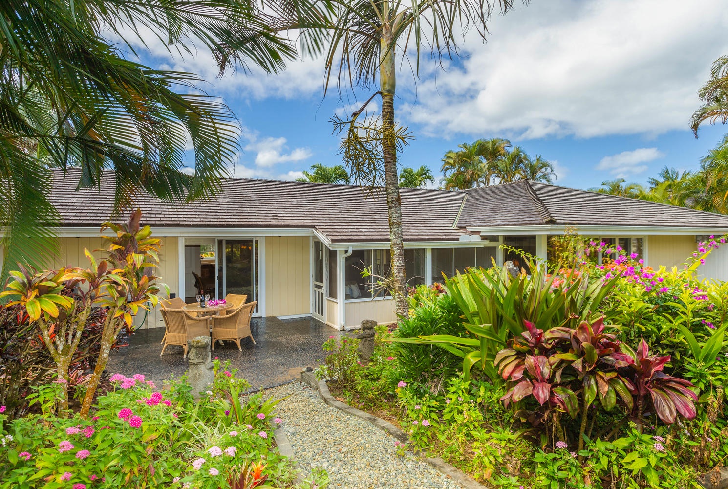 Princeville Vacation Rentals, Mala Hale - View of outdoor seating from the backyard garden